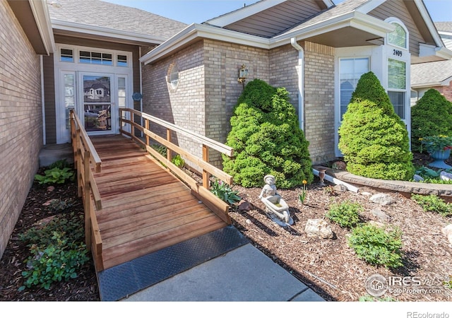 2409 Rock Creek Dr, Fort Collins, CO 80528 - property entrance with brick siding and roof with shingles
