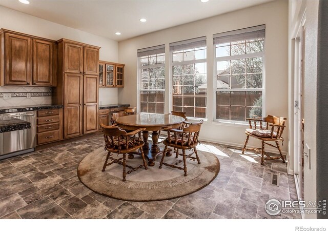 2409 Rock Creek Dr, Fort Collins, CO 80528 - dining room featuring recessed lighting, dark stone finish floors, and baseboards