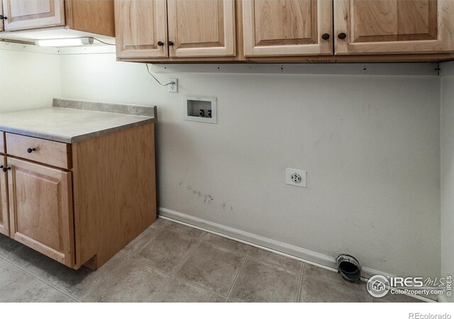 2409 Rock Creek Dr, Fort Collins, CO 80528 - clothes washing area with cabinet space, baseboards, and washer hookup