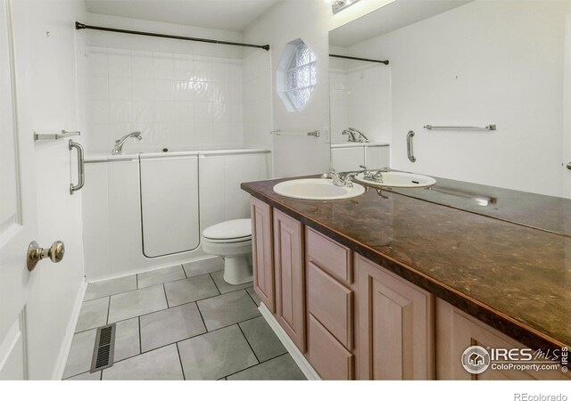 2409 Rock Creek Dr, Fort Collins, CO 80528 - bathroom with tile patterned flooring, vanity, and toilet