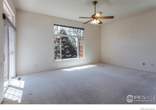 2409 Rock Creek Dr, Fort Collins, CO 80528 - carpeted empty room with a ceiling fan and baseboards