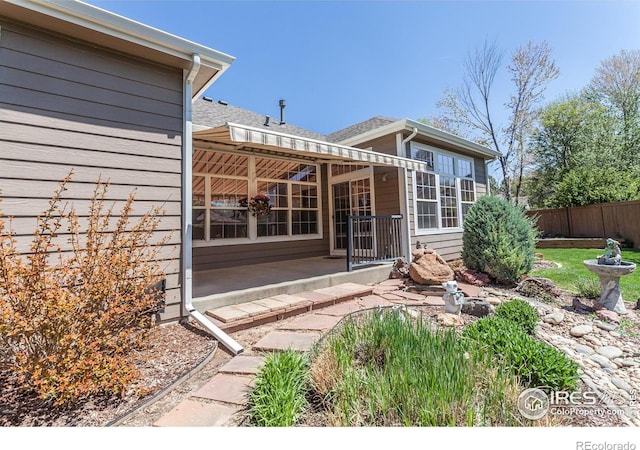 2409 Rock Creek Dr, Fort Collins, CO 80528 - rear view of property with fence and a patio area