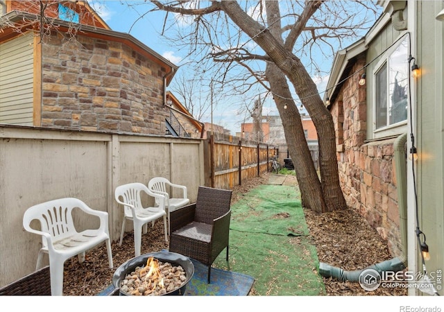2315 Spruce St, Boulder, CO 80302 - fenced backyard featuring an outdoor fire pit