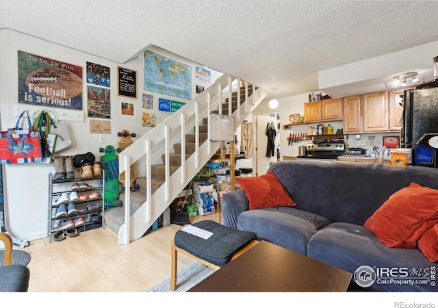 2315 Spruce St, Boulder, CO 80302 - living room with stairway, wood finished floors, and a textured ceiling