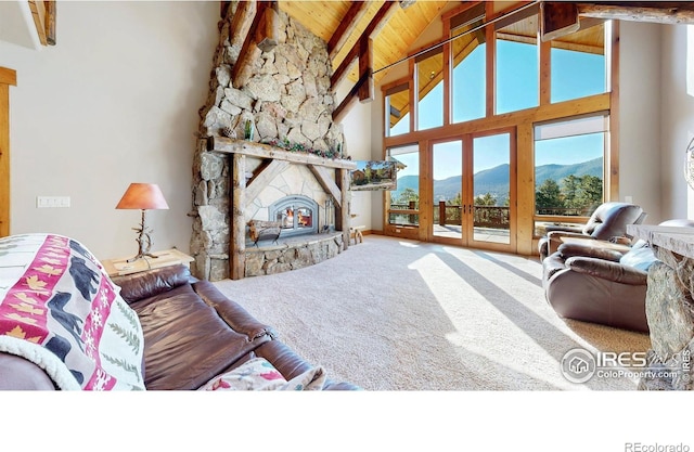 1049 Pine Knoll Dr, Estes Park, CO 80517 - living area featuring a mountain view, carpet flooring, high vaulted ceiling, beamed ceiling, and wood ceiling