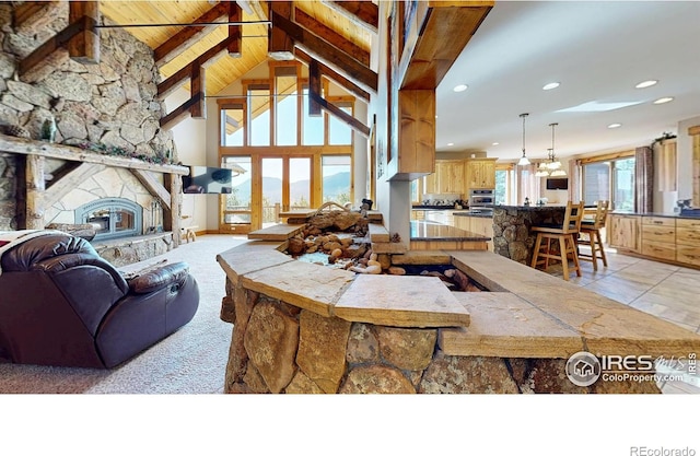 1049 Pine Knoll Dr, Estes Park, CO 80517 - living room with recessed lighting, beam ceiling, a fireplace, high vaulted ceiling, and wooden ceiling