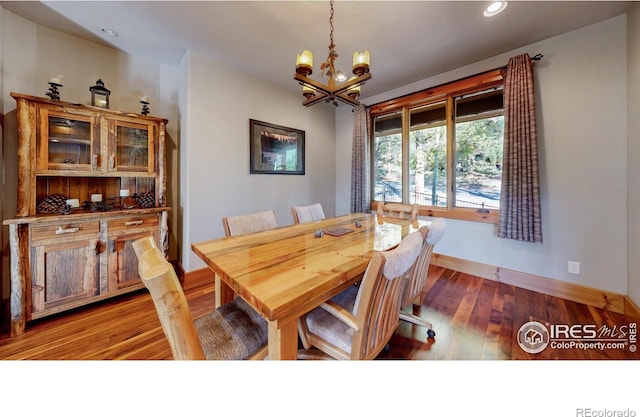 1049 Pine Knoll Dr, Estes Park, CO 80517 - dining room with a chandelier, baseboards, wood finished floors, and recessed lighting