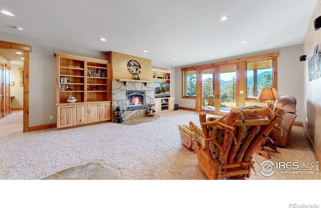 1049 Pine Knoll Dr, Estes Park, CO 80517 - living room with carpet floors, recessed lighting, baseboards, a fireplace, and french doors