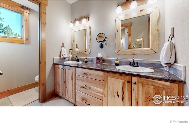 1049 Pine Knoll Dr, Estes Park, CO 80517 - bathroom with double vanity and toilet