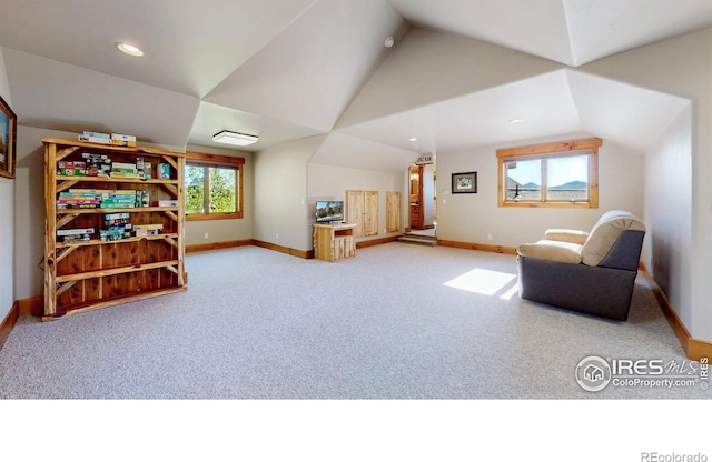 1049 Pine Knoll Dr, Estes Park, CO 80517 - living area featuring carpet flooring, lofted ceiling, baseboards, and recessed lighting