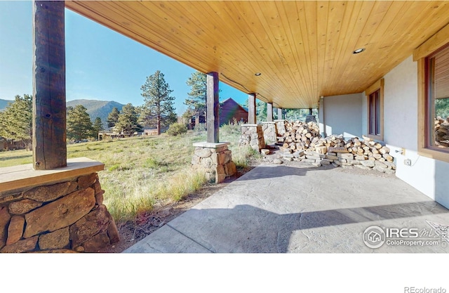 1049 Pine Knoll Dr, Estes Park, CO 80517 - view of patio / terrace with a mountain view