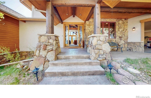 1049 Pine Knoll Dr, Estes Park, CO 80517 - entrance to property featuring stone siding and stucco siding