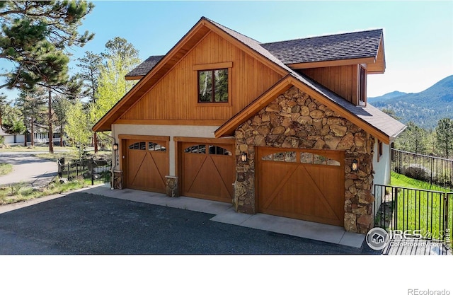 1049 Pine Knoll Dr, Estes Park, CO 80517 - garage featuring fence and a mountain view