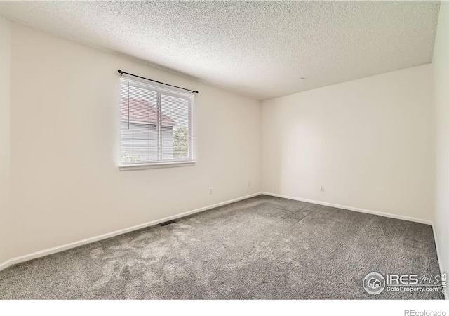 1842 Reliance Cir, Superior, CO 80027 - spare room with carpet flooring, a textured ceiling, and baseboards