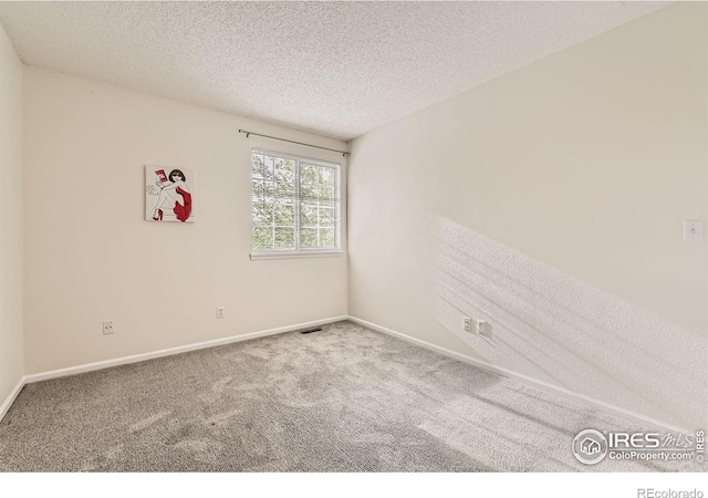1842 Reliance Cir, Superior, CO 80027 - carpeted spare room featuring baseboards and a textured ceiling