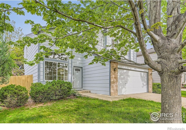 1842 Reliance Cir, Superior, CO 80027 - view of front of house with brick siding, concrete driveway, and an attached garage