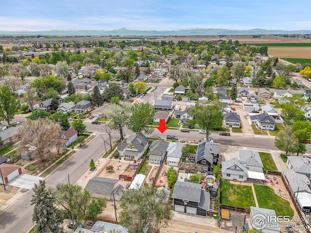 aerial perspective of suburban area with a mountainous background