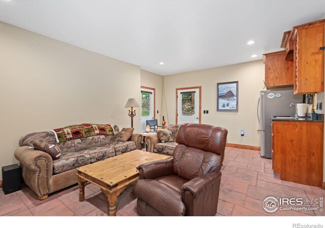 200 Falls Creek Dr, Bellvue, CO 80512 - living room with recessed lighting, stone tile flooring, and baseboards