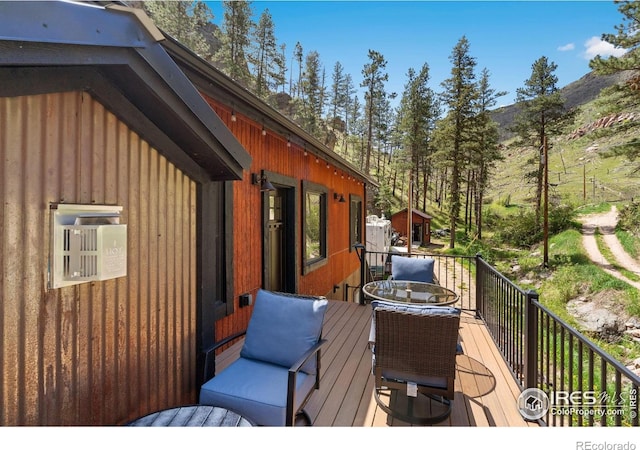 200 Falls Creek Dr, Bellvue, CO 80512 - deck with outdoor dining space and a mountain view
