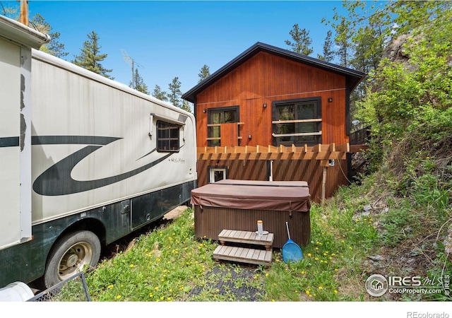 200 Falls Creek Dr, Bellvue, CO 80512 - view of home's exterior featuring a hot tub