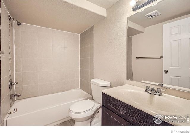 bathroom with a textured wall, toilet, shower / bathtub combination, vanity, and a textured ceiling