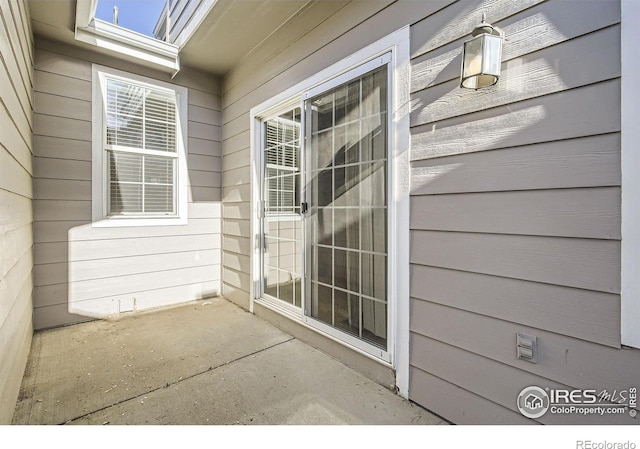 entrance to property featuring a patio
