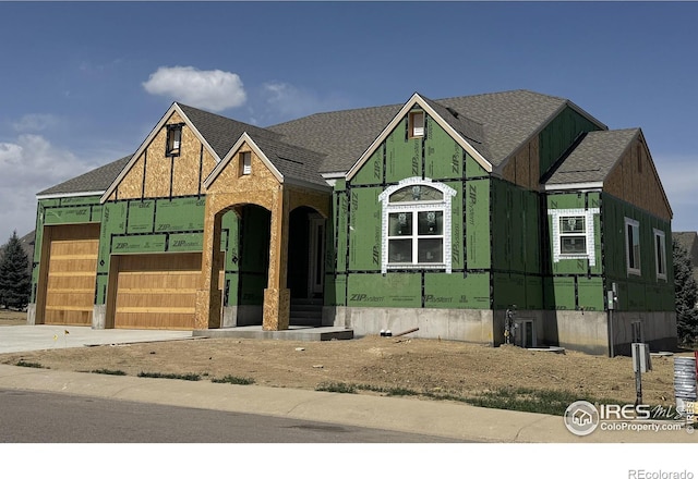 1156 Bordeaux Dr, Fort Collins, CO 80526 - view of front of home with a shingled roof, concrete driveway, and a garage
