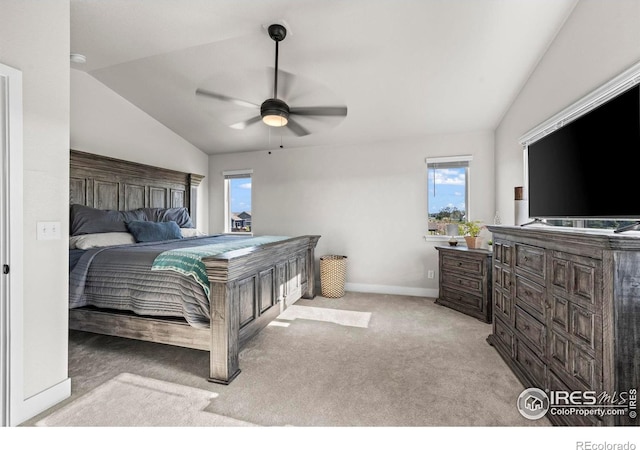 bedroom featuring vaulted ceiling, carpet, baseboards, and ceiling fan
