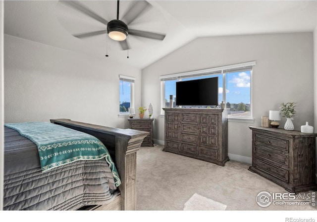 carpeted bedroom featuring vaulted ceiling, ceiling fan, and baseboards