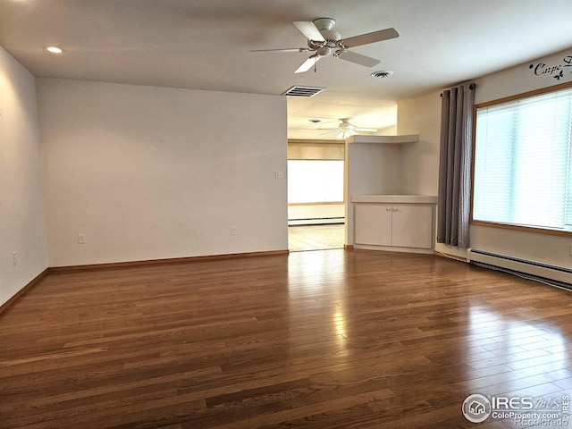 107 Fairway Ln, Fort Morgan, CO 80701 - spare room with a ceiling fan, wood finished floors, baseboard heating, and recessed lighting