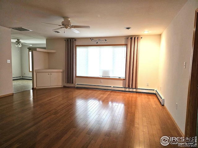 107 Fairway Ln, Fort Morgan, CO 80701 - spare room with a ceiling fan, a baseboard heating unit, hardwood / wood-style floors, and baseboards