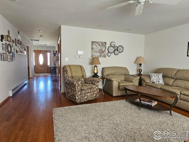 107 Fairway Ln, Fort Morgan, CO 80701 - living area featuring a baseboard radiator, dark wood-style flooring, and ceiling fan