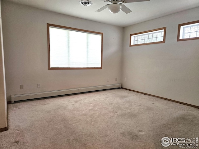 107 Fairway Ln, Fort Morgan, CO 80701 - carpeted empty room with a baseboard radiator, ceiling fan, and baseboards