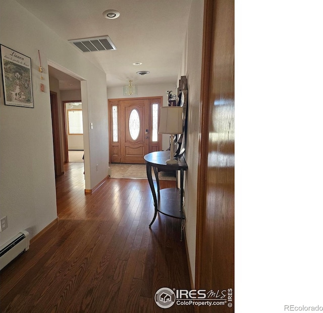 107 Fairway Ln, Fort Morgan, CO 80701 - foyer with a baseboard heating unit, wood finished floors, baseboards, and recessed lighting