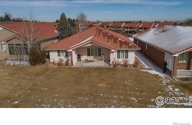 107 Fairway Ln, Fort Morgan, CO 80701 - back of property featuring stucco siding, a tiled roof, and a patio