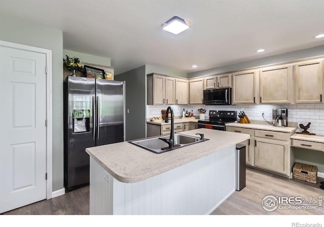39 Sebring Ln, Johnstown, CO 80534 - kitchen with stainless steel fridge with ice dispenser, range with electric cooktop, light wood-style flooring, and tasteful backsplash