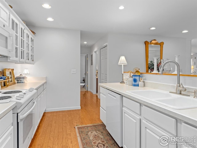 160 Riverside Dr Unit 2, Estes Park, CO 80517 - kitchen featuring a sink, white appliances, light wood-style floors, recessed lighting, and white cabinetry