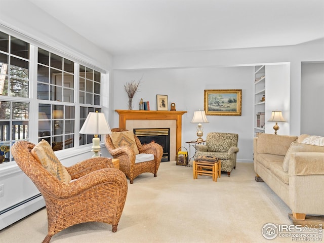 160 Riverside Dr Unit 2, Estes Park, CO 80517 - living room featuring baseboard heating, carpet flooring, and a tiled fireplace