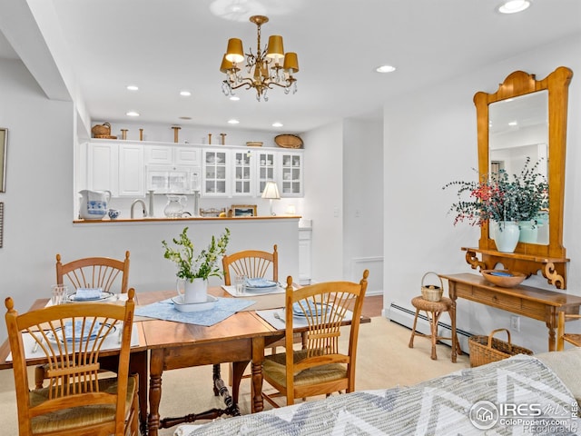 160 Riverside Dr Unit 2, Estes Park, CO 80517 - dining area with recessed lighting, a chandelier, baseboard heating, light carpet, and baseboards