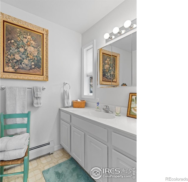 160 Riverside Dr Unit 2, Estes Park, CO 80517 - bathroom featuring a baseboard radiator, tile patterned floors, and vanity
