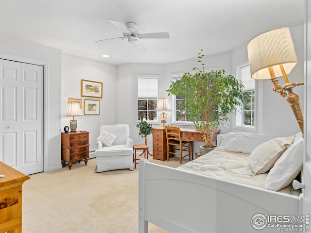 160 Riverside Dr Unit 2, Estes Park, CO 80517 - carpeted bedroom with a ceiling fan, a closet, an office area, and a baseboard radiator