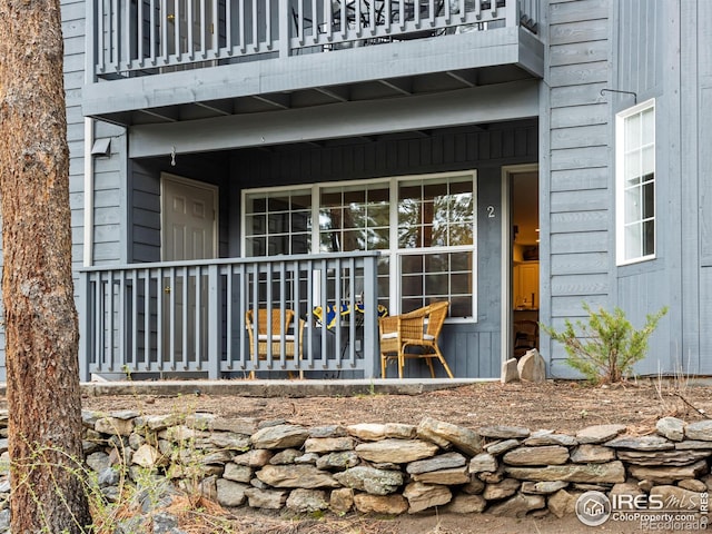 160 Riverside Dr Unit 2, Estes Park, CO 80517 - view of exterior entry featuring a balcony and a porch