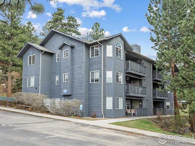 160 Riverside Dr Unit 2, Estes Park, CO 80517 - view of property exterior featuring a chimney
