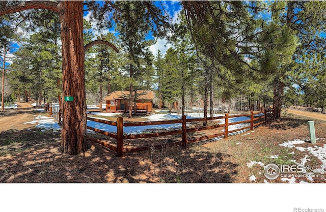 6 Norske Trl, Allenspark, CO 80510 - view of yard featuring fence and view of wooded area