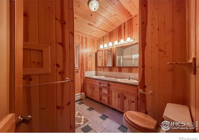 6 Norske Trl, Allenspark, CO 80510 - bathroom featuring a baseboard heating unit, toilet, wooden ceiling, wooden walls, and vaulted ceiling