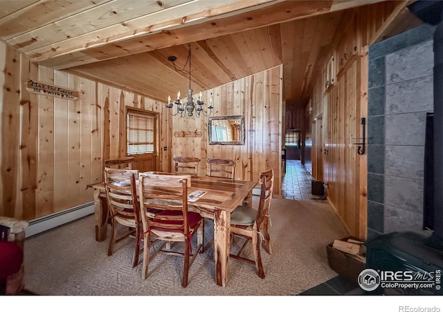 6 Norske Trl, Allenspark, CO 80510 - carpeted dining space featuring a baseboard radiator, a chandelier, wooden walls, wood ceiling, and lofted ceiling