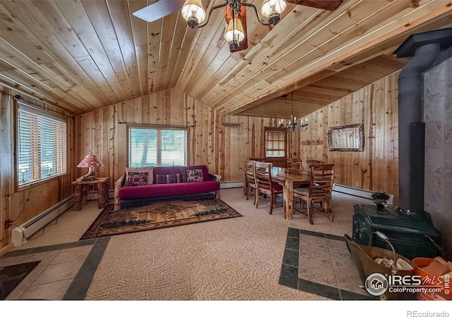 6 Norske Trl, Allenspark, CO 80510 - carpeted living room with a wood stove, lofted ceiling, wooden walls, a chandelier, and wood ceiling