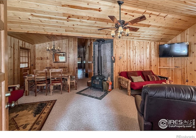 6 Norske Trl, Allenspark, CO 80510 - living room with wooden ceiling, wooden walls, ceiling fan, lofted ceiling, and a wood stove