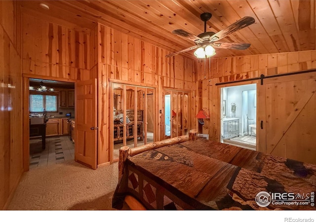 6 Norske Trl, Allenspark, CO 80510 - bedroom with wood walls, lofted ceiling, wooden ceiling, a closet, and ensuite bath