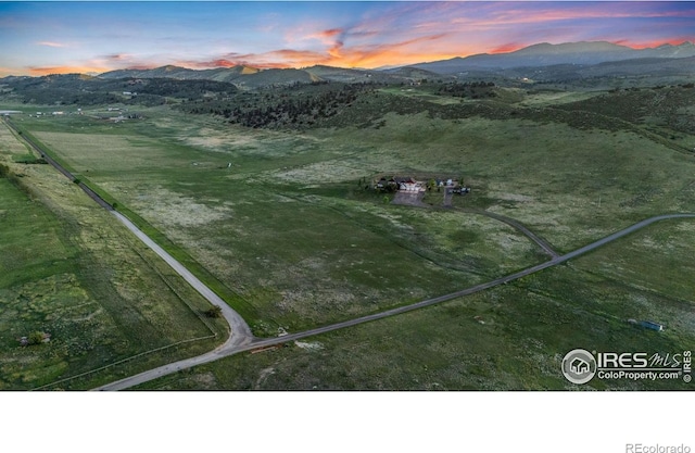 6950 W County Road 18, Loveland, CO 80537 - aerial view at dusk of a mountain view and a rural view